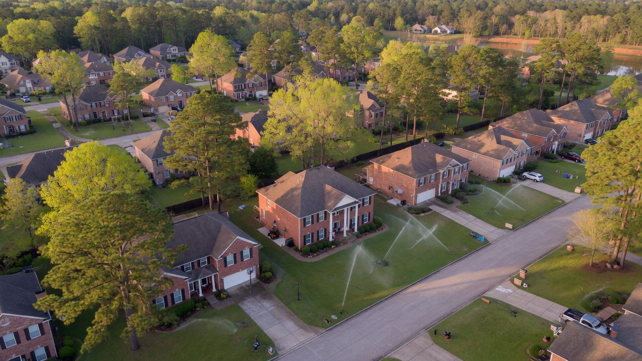 Bedford Texas neighborhood lawns with sprinklers running
